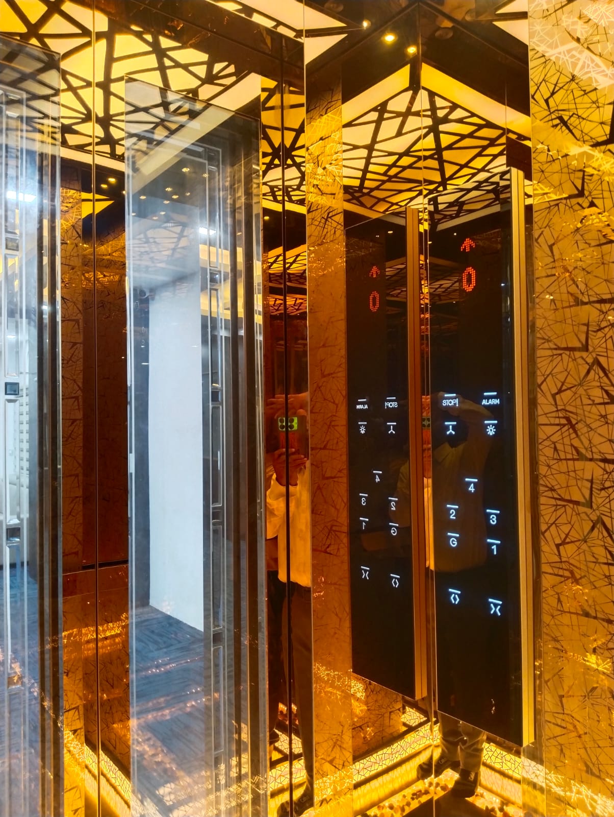 Gold elevator cabin interior with touch control panel
