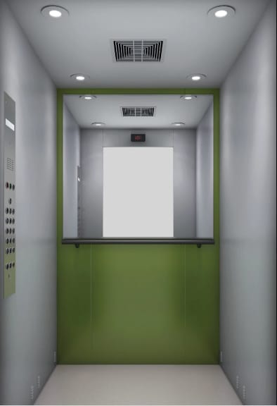 Elevator cabin with green wall panels and stainless handrail